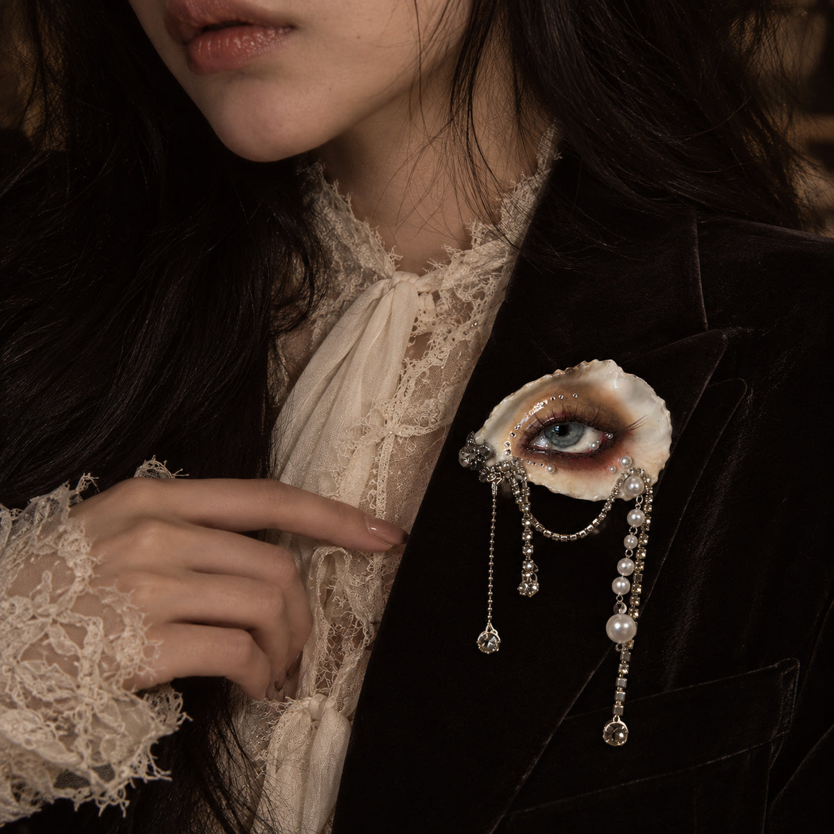 Sereine Eye LV027 — brooch styling on dark clothing