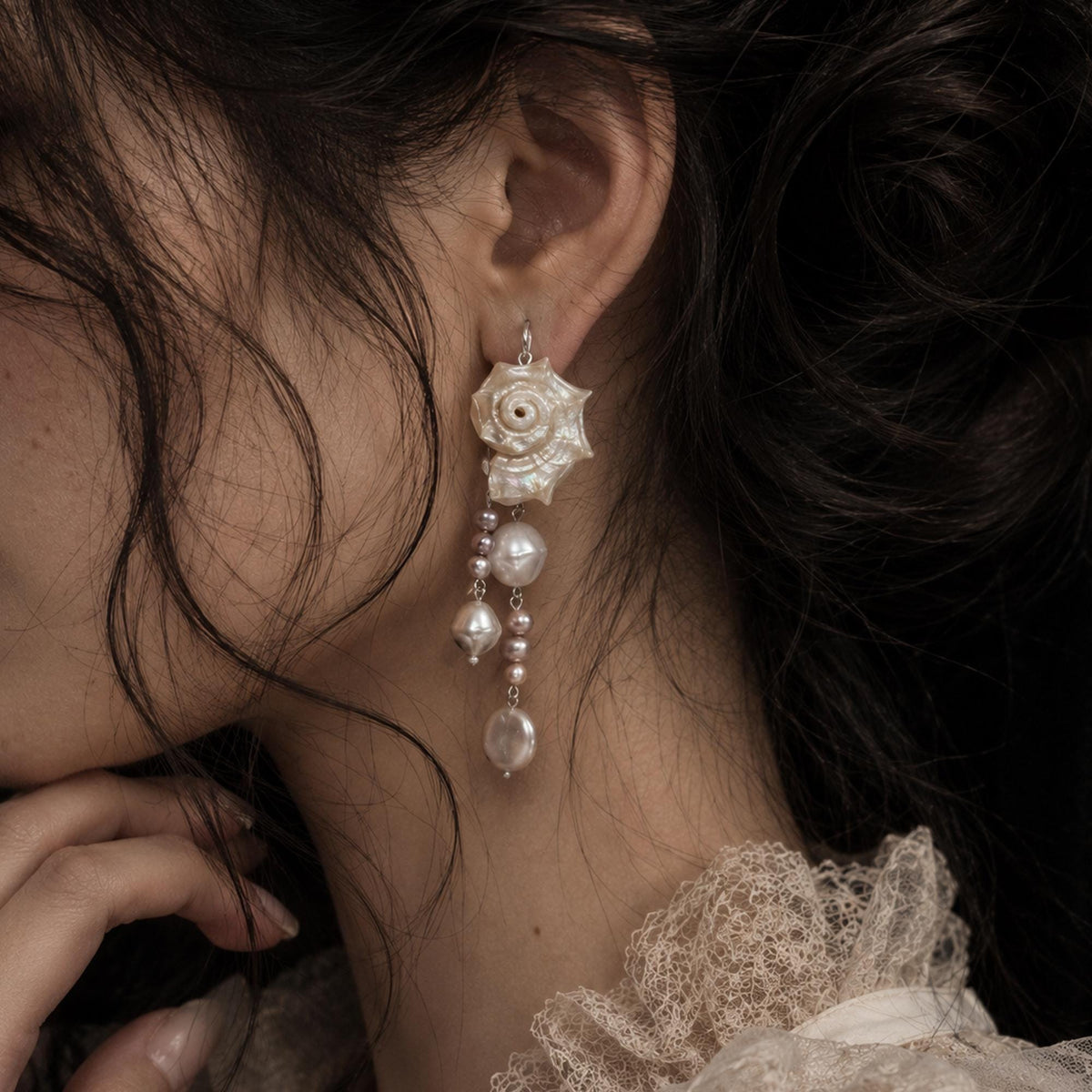 Pair of Natural Conch Shell Pearl Earrings — primary view