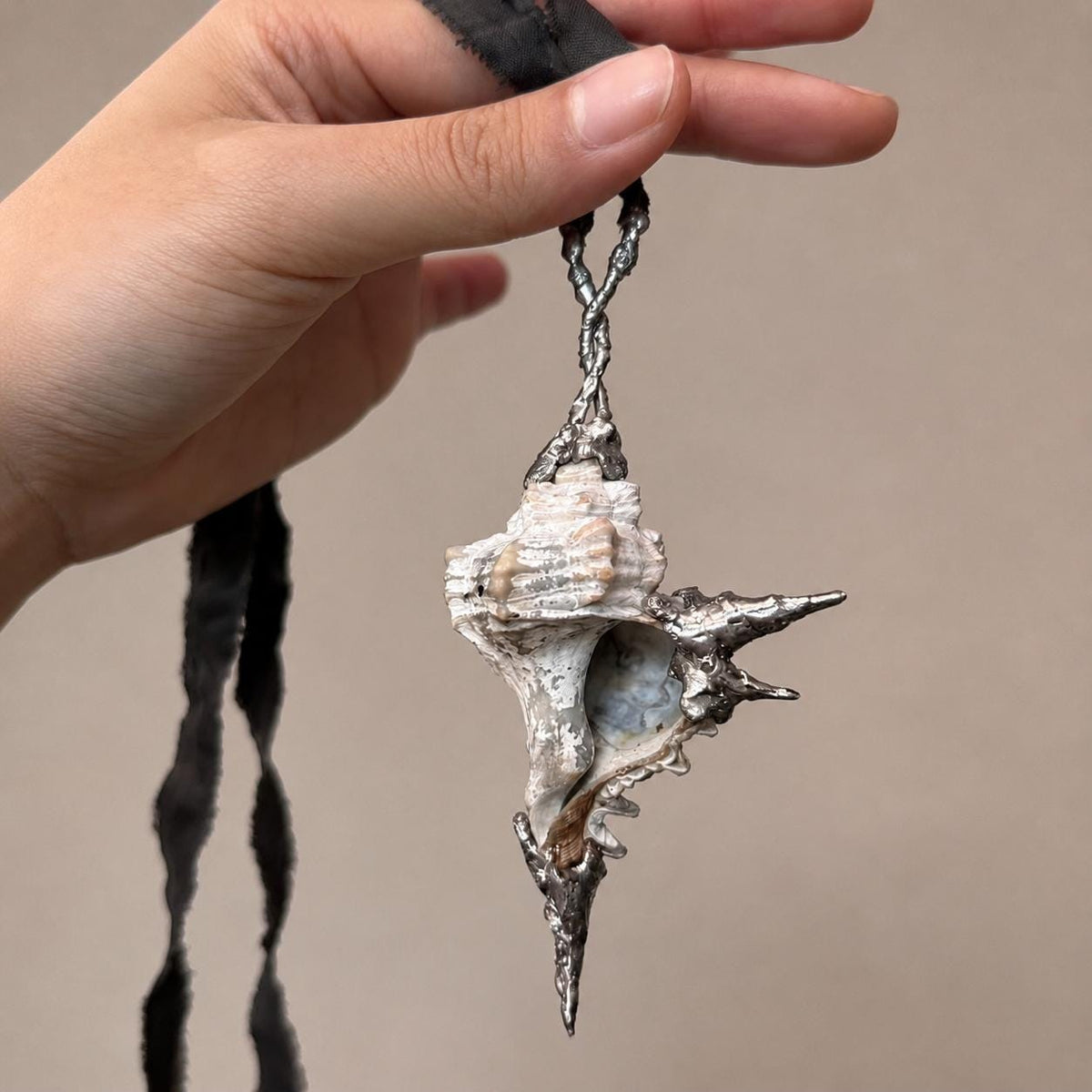 Spiked Conch Loop Talisman — artwork and styling view 4