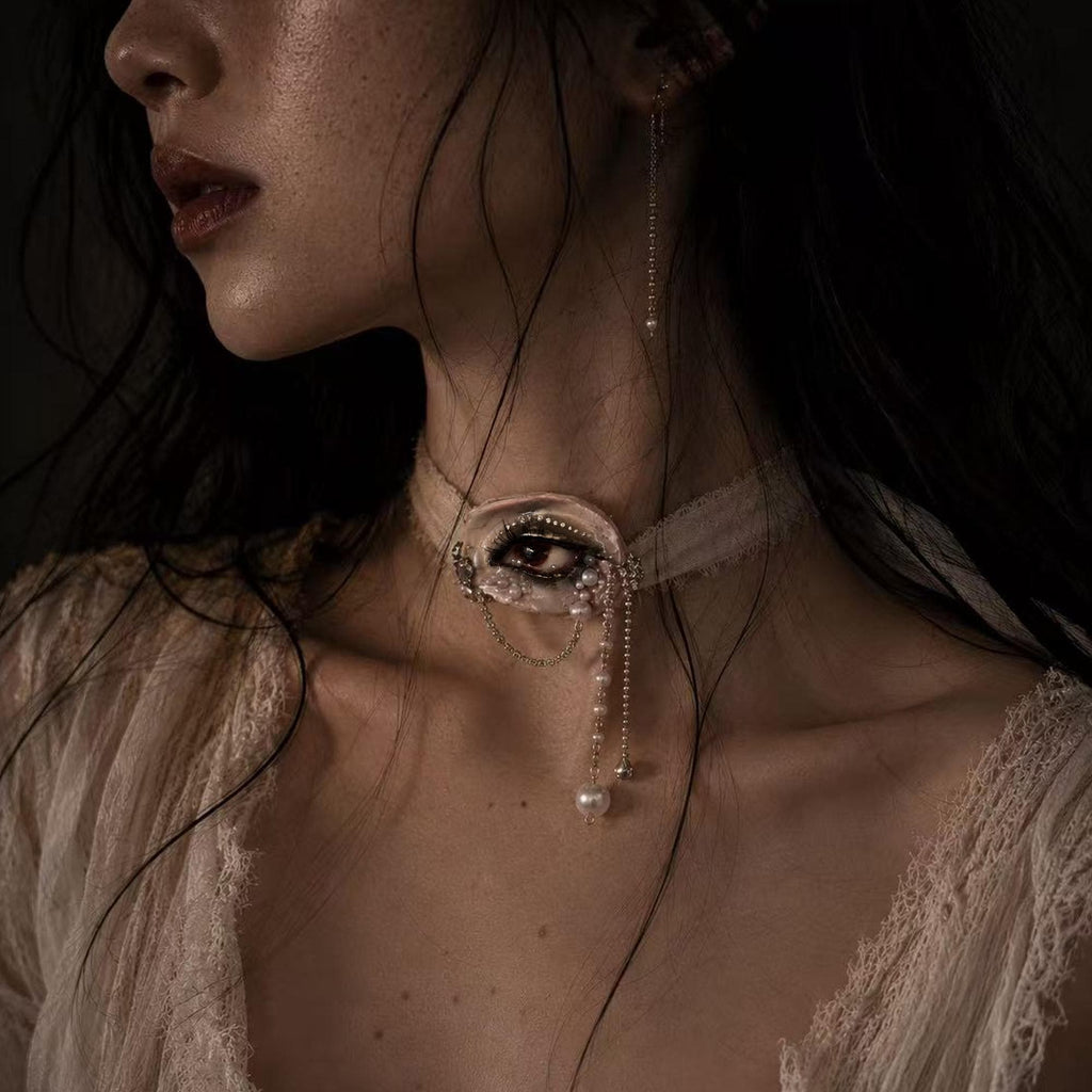 Modeled close-up wearing Lilith Veil as an ivory ribbon choker