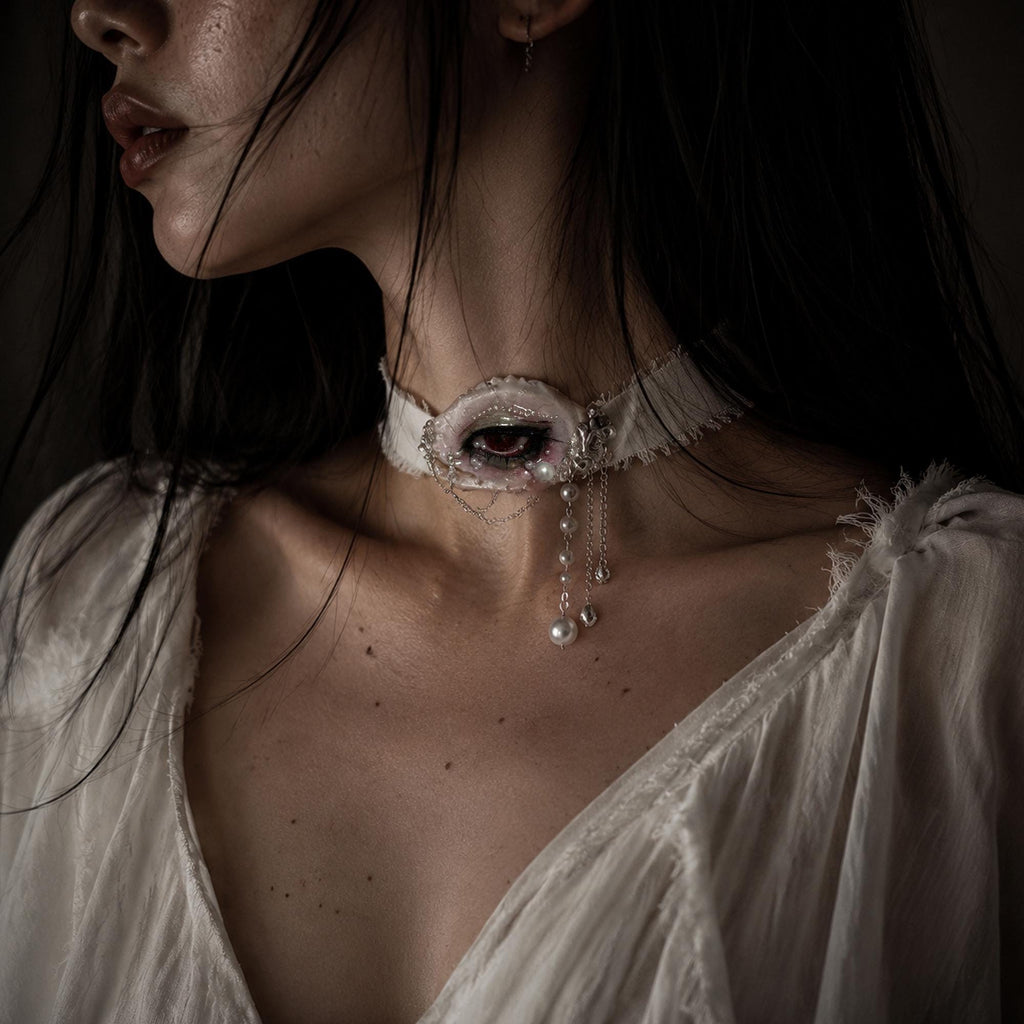 Modeled close-up wearing Lilith Veil on an ivory ribbon choker